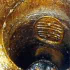 Photograph showing the deposits of grease and dirt on the inside of a kitchen ventilation duct that cause poor air quality and can spread fire rapidly through the building if ignited.