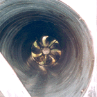 Photograph of a kitchen ventilation duct and an extractor fan that have been cleaned back to bare metal by Greasebusters, removing the risk of fire and improving the efficiency of the ventilation system.